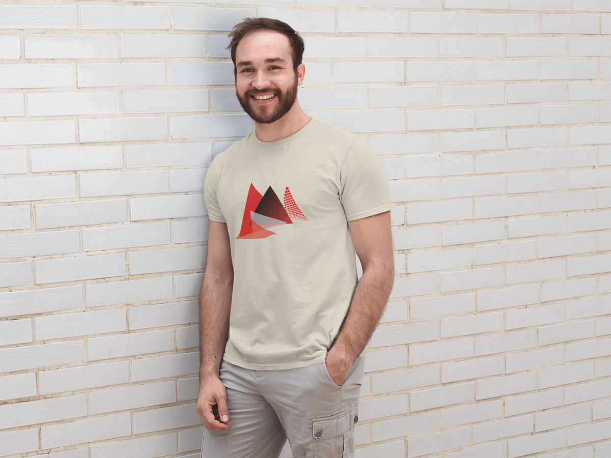 Model wearing the sand Apex Triangle tee with red geometric motif.