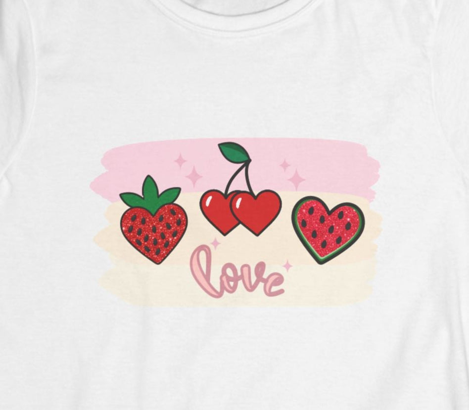 Close‑up of the fruit trio graphic—strawberry, cherry, and watermelon slice—with the word ‘Love’ written in cursive beneath