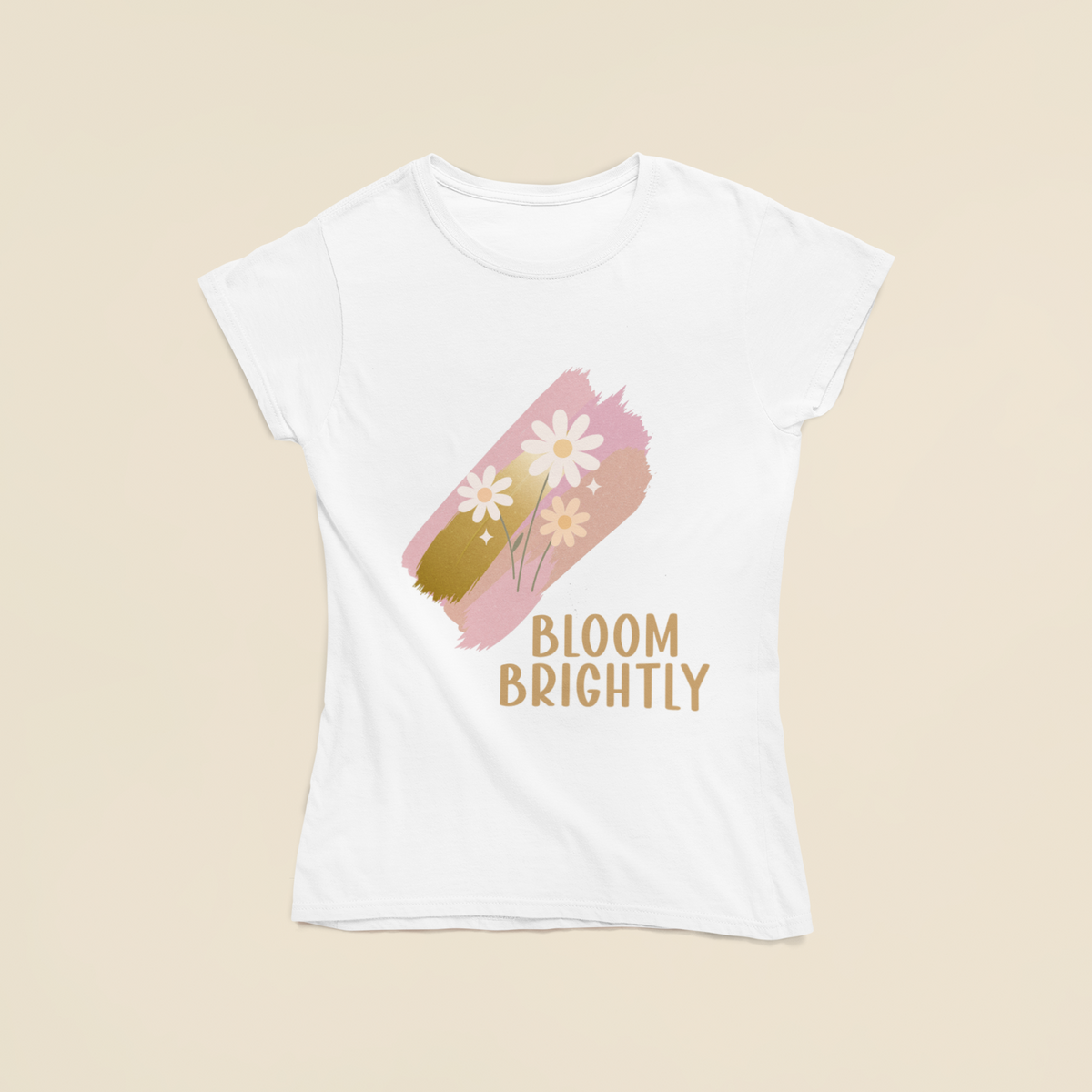 Flat‑lay view of a white t‑shirt featuring a pastel brushstroke daisy motif.