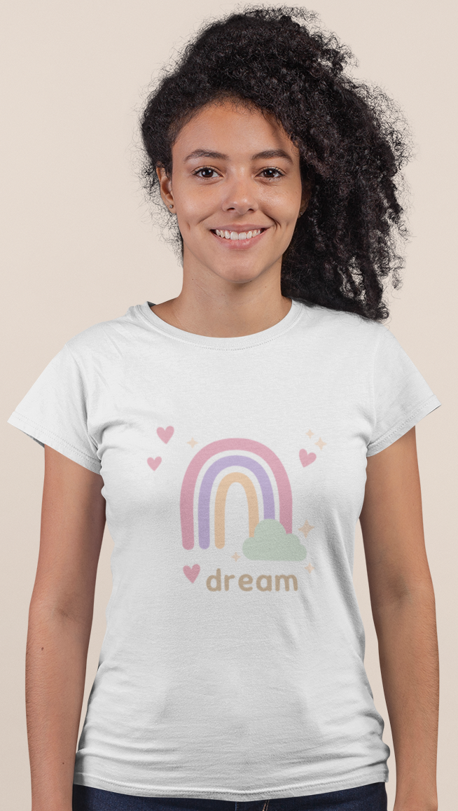 Model wearing the Dream Pastel Rainbow Tee, showcasing the soft rainbow and heart motif on a white Bella+Canvas 6004 slim‑fit tee.