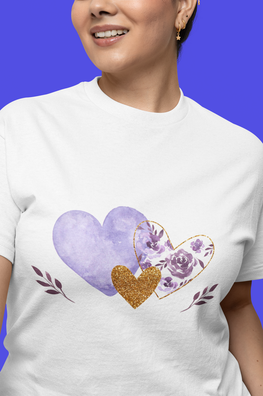 Model wearing the White tee featuring the lavender and gold floral heart motif.  