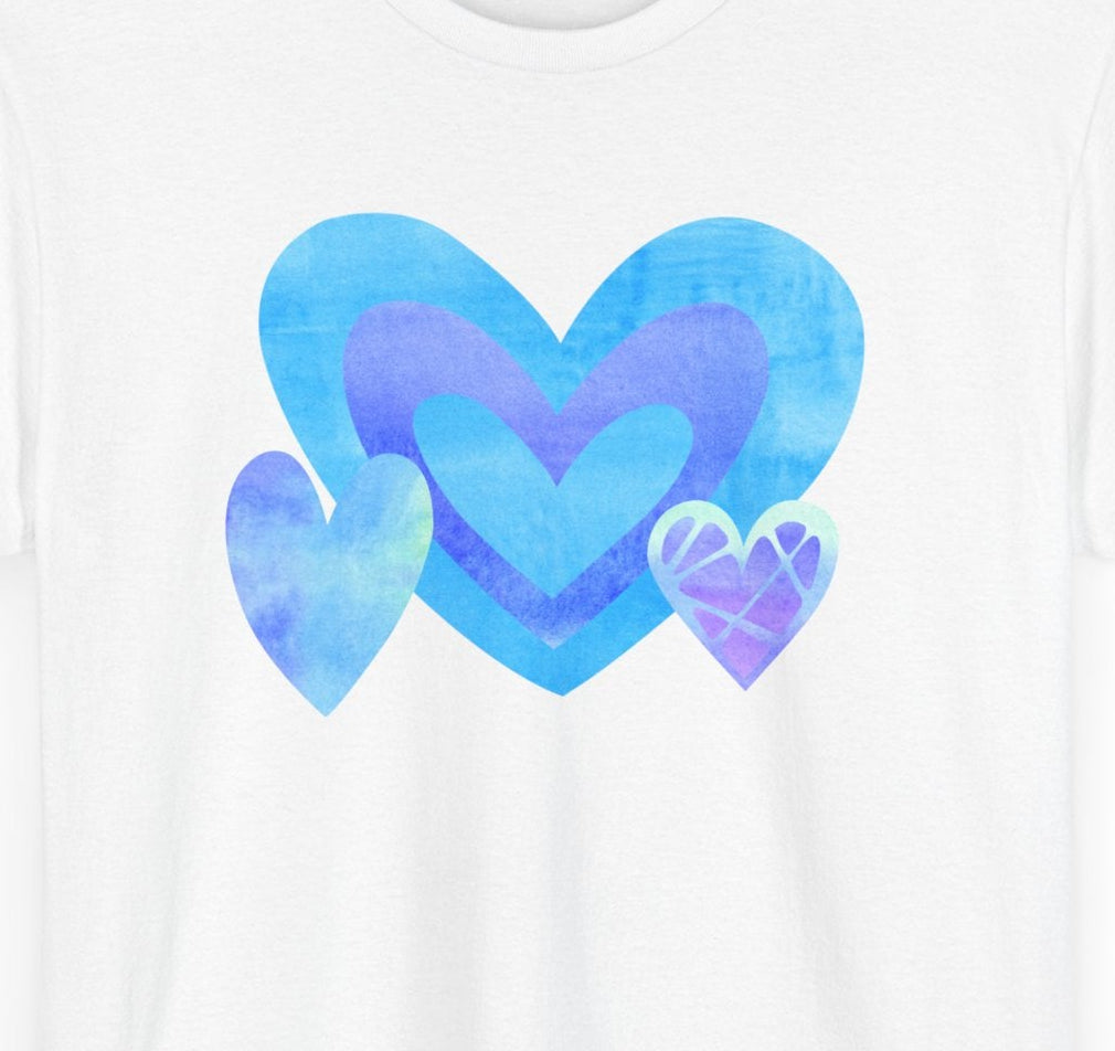 Close‑up of the layered blue, purple, and blush triple‑heart motif showing watercolour texture.