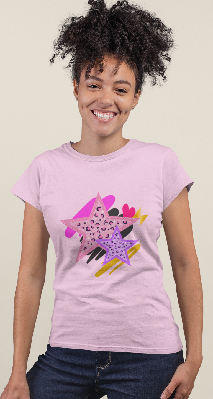 Model wearing Pink Leopard Star Tee with layered leopard‑print star motif and painterly brushstroke details.d