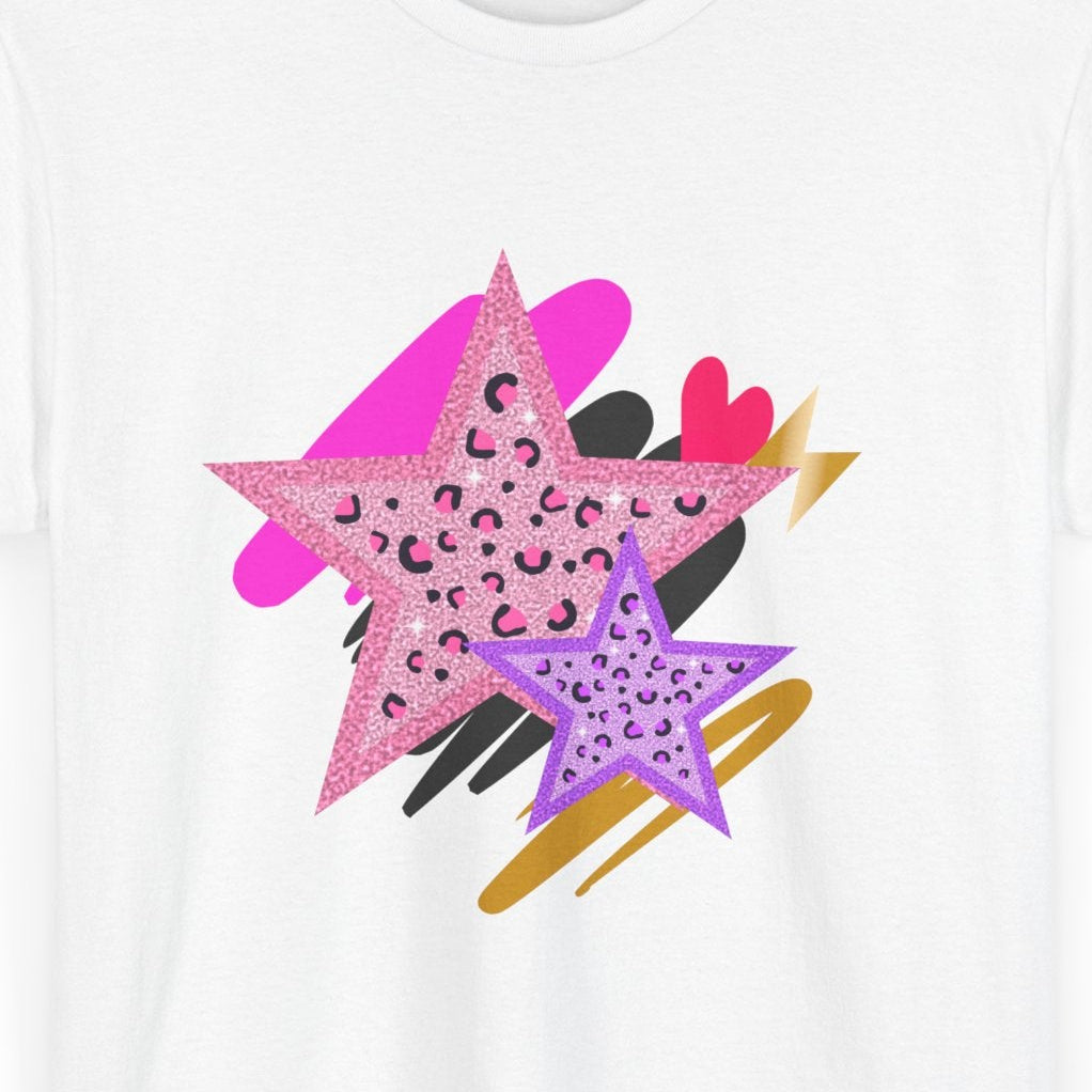 Close up of leopard Star Tee on white shirt with pink and purple leopard‑print stars and layered brushstroke accents.