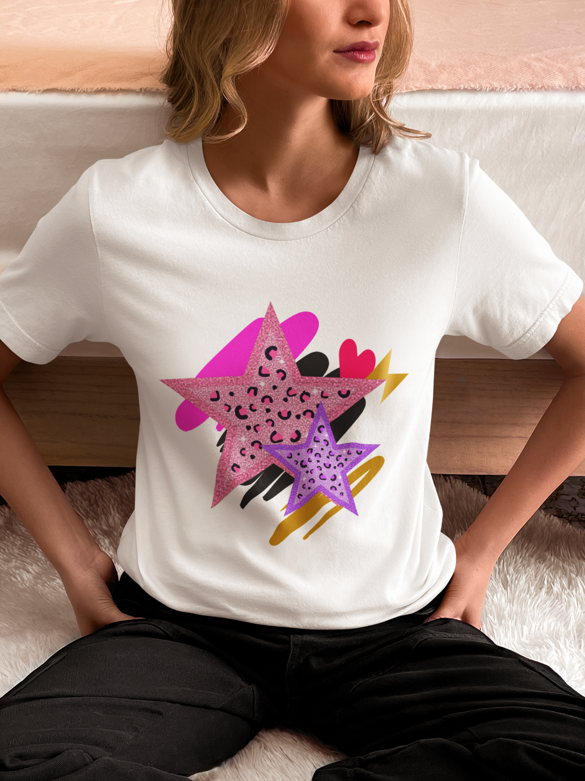 Model wearing White Leopard Star Tee with bold leopard‑print star motif and layered brushstroke textures