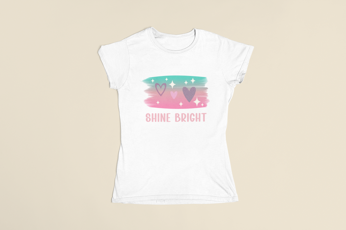 Flatlay of the Shine Bright Pastel Tee showing the full pastel stars and heart motif.