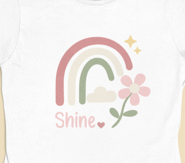 Close‑up of the Shine Pastel Rainbow motif with pastel rainbow, soft stars, and floral accent.
