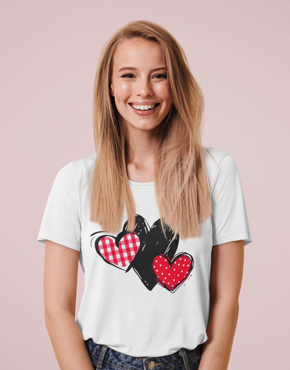 White T‑shirt with gingham, sketch, and polka dot triple‑heart motif, worn by model.